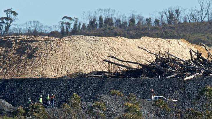 EPA and mine staff inspect the damage. Photo: Wolter Peeters