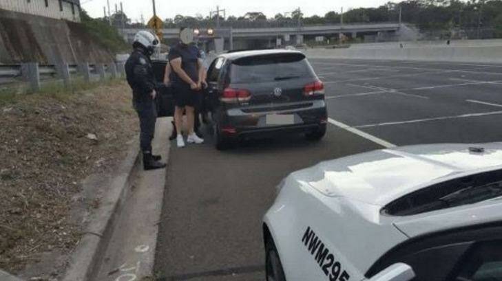 Police speak to a driver caught doing 199km/h in a 100 km/h zone in Beecroft on Christmas Eve. Photo: NSW Police