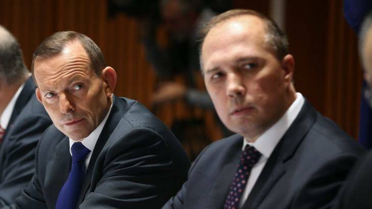 The then prime minister with Immigration Minister Peter Dutton. Photo: Alex Ellinghausen