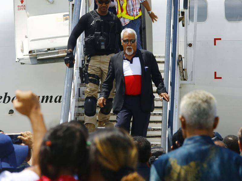 East Timor's Xanana Gusmao, has received a hero's welcome after signing a treaty with Australia.