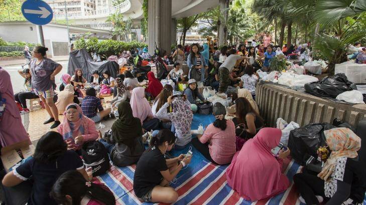 Indonesian domestic helpers gather on their day off in Hong Kong. Photo: Alex Hofford