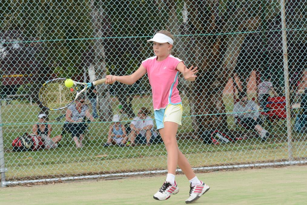 HERE IT COMES: Tayla Brasier lets a forehand loose in her girls under 12s singles match yesterday at the Bathurst Tennis Centre. Photo: PHILL MURRAY 0222815pbrazier1