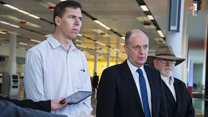 "It's quite possible there'll be no quick response to this": Australian Transport Safety Bureau Chief Commissioner Martin Dolan flanked by senior transport investigators Paul Ballard and John Robins as they prepare to depart for Kiev. Photo: Elesa Kurtz
