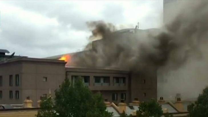 Flames and black smoke were visible at a building blaze in Haymarket on Monday. Photo: Seven News