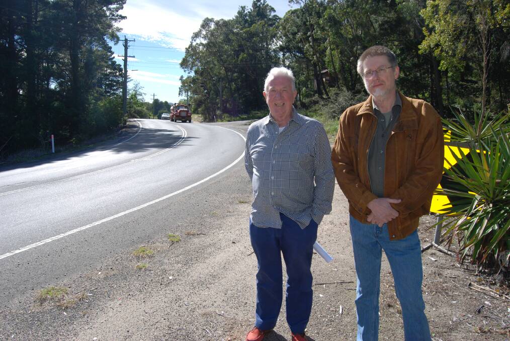 Architect Peter Buckwell and local David May near the Mt Piddington Road corner where they want a new link road built.