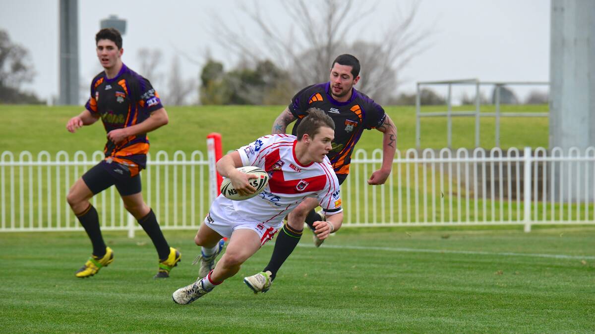 HE'S OVER: Mudgee Dragons' James O'Connell scores the first try of Sunday's win over Lithgow Workies. Photo: COL BOYD