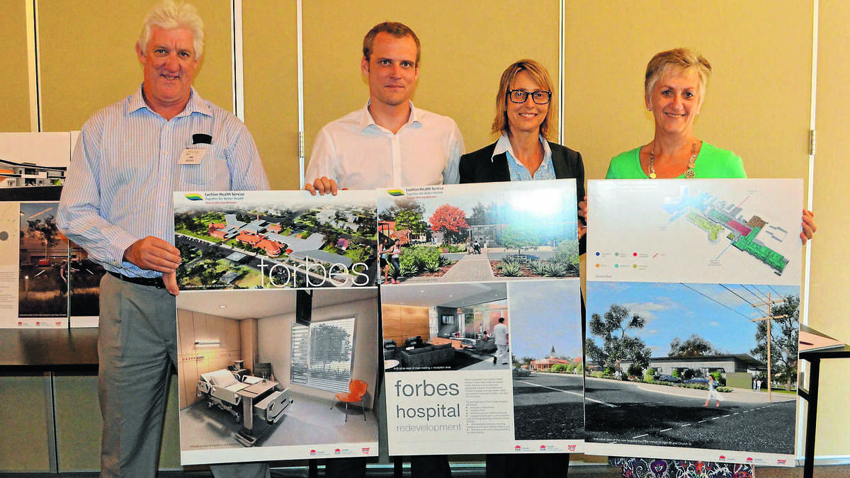 FORBES: Appian Group site representative and construction coordinator Ian Delves, Appian Group project manager Clancy Mears, NSW Health Infrastructure project director Susann Taylor and Lachlan Health Service project manager Deborah Hunter, with the updated plans for the refurbished Forbes Hospital. 0314hospitalplans