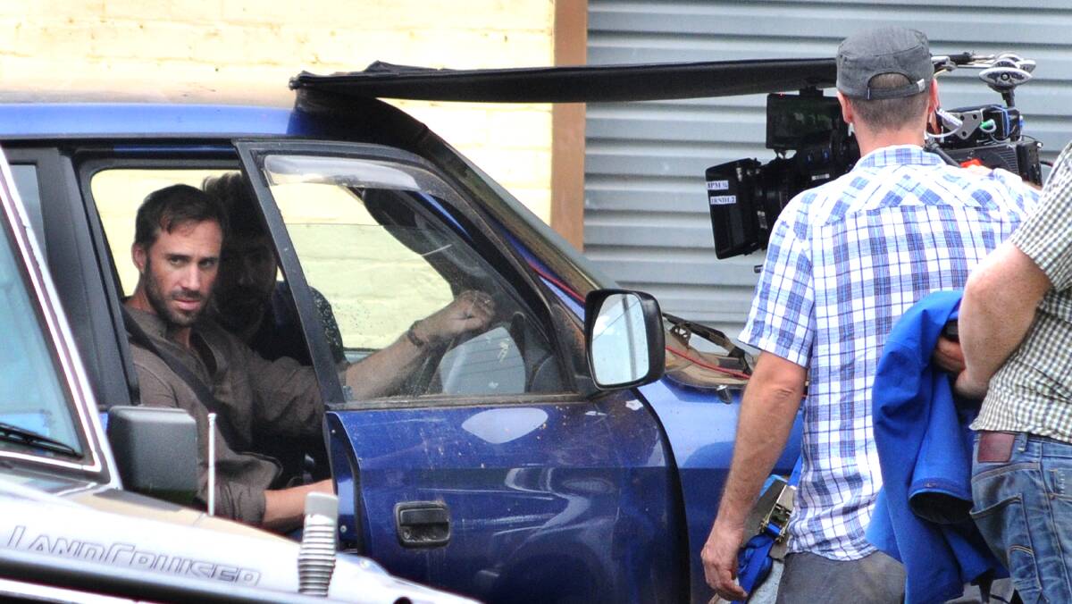 IN THE DRIVER'S SEAT: Joseph Fiennes on set at Canowindra. Photo: STEVE GOSCH