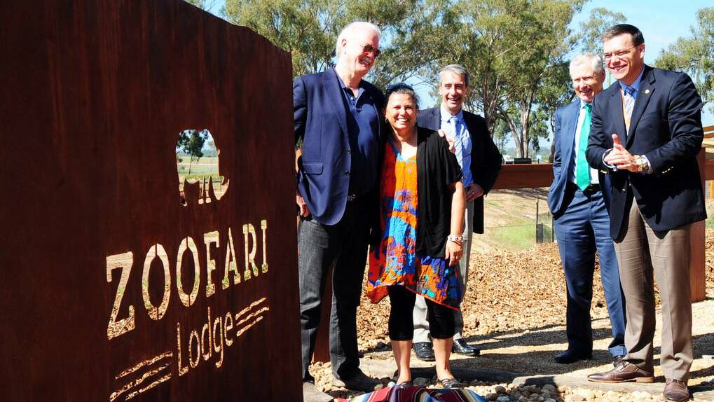 DUBBO: Diana McNaboe is congratulated by Taronga Foundation patron, actor and comedian John Cleese, after delivering the Welcome to Country at the official opening of new lodges at Taronga Western Plains Zoo (TWPZ) yesterday. Watching on are Taronga chief executive officer and director Cameron Kerr, deputy chairman of the Taronga board Steve Crane and general manager of TWPZ Matt Fuller. Photo: BELINDA SOOLE