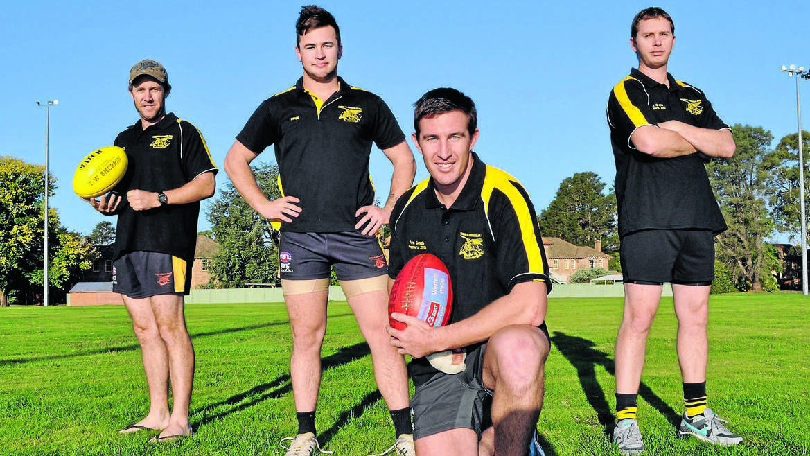 ORANGE: Tigers leadership group members (from left) Corey McKenzie (backline), Michael Rothnie (vice-captain), Tim Barry (captain) and Dale Hunter (forward line) prepare to lead the black and golds in the clu­b’s 2014 Central West AFL premiership defence. Photo: NICK McGRATH 0401nmafl