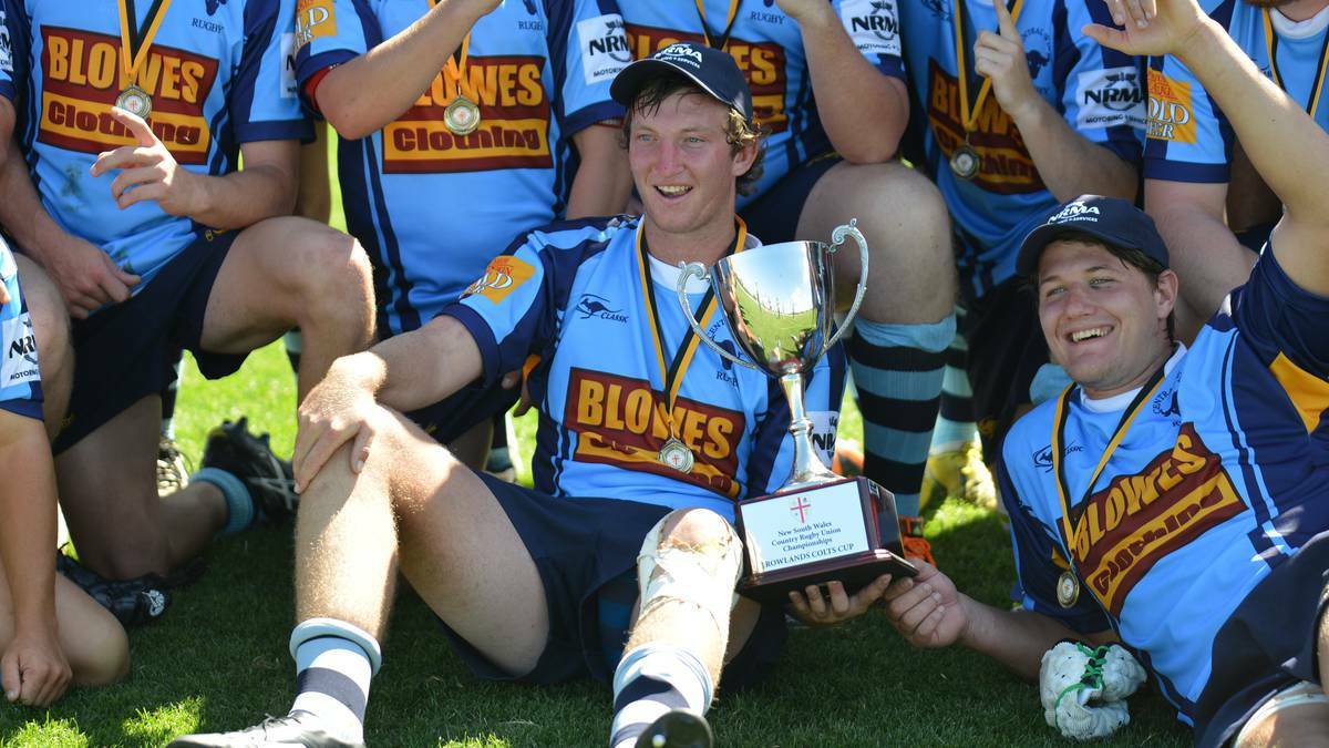 MUDGEE: Orange City's Ben Wright with the spoils after the Blue Bulls colts claimed the NSW Country Championship crown at the Glen Willow Sports Complex on the weekend. Photo: COL BOYD