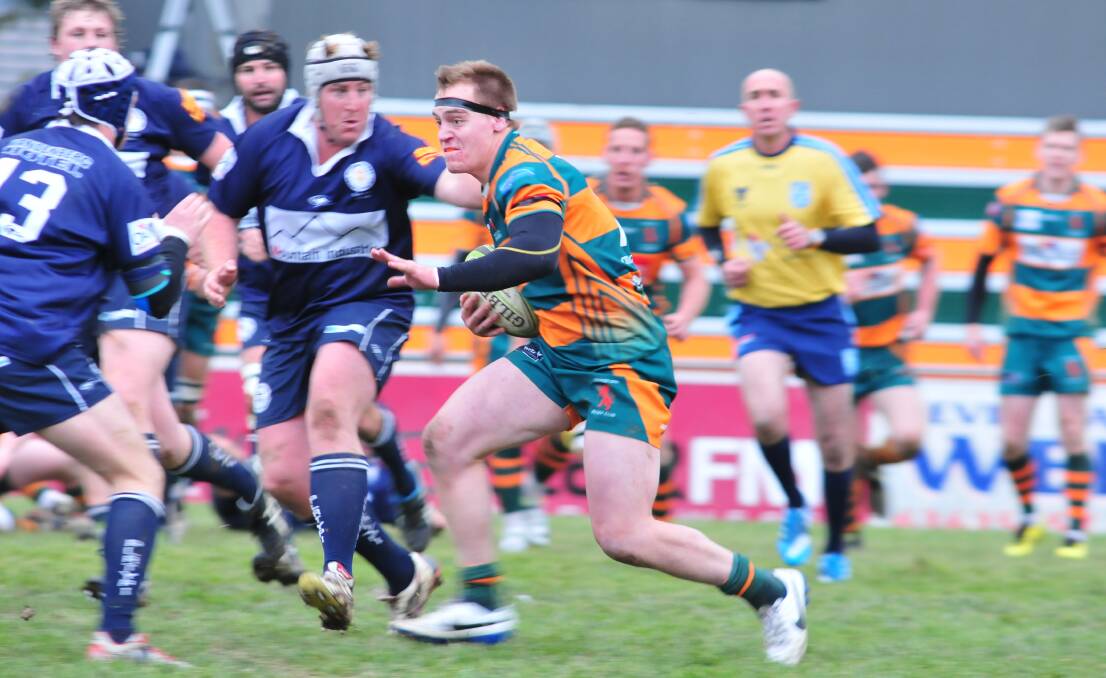 FULL TILT: Orange City Lions' Gus Brotherton charges into the Forbes Platypi's defence during his side's 25-19 win over Forbes Platypi on Saturday. Photo: JUDE KEOGH