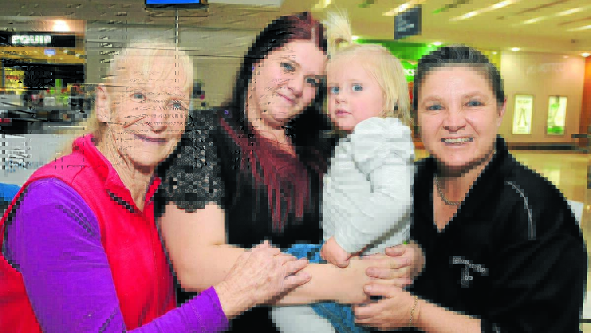 CLOSE TO HOME: Great-grandmother Pauline Straney with her granddaughter Michaela Jacobs, great-granddaughter Ruby Phillips and daughter Dionne Jacobs. Ms Straney hopes heightened awareness of a rare genetic condition can help find a cure. Photo: JUDE KEOGH                                                                                                                                                                                                                                   0525memorable2
