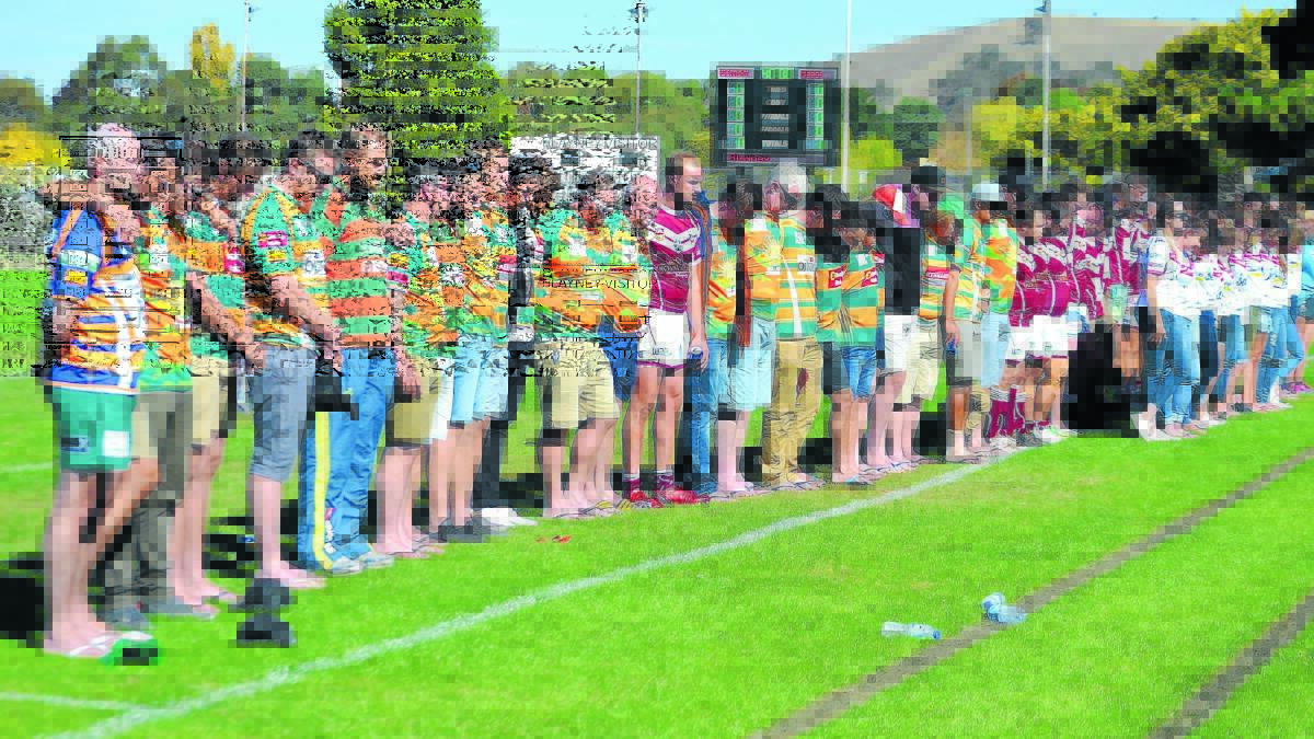POIGNANT MOMENT: Players and well-wishers from Orange City Lions and Blayney come together for missing Bears half Terry Brown. Photo: PETE GUTHRIE
