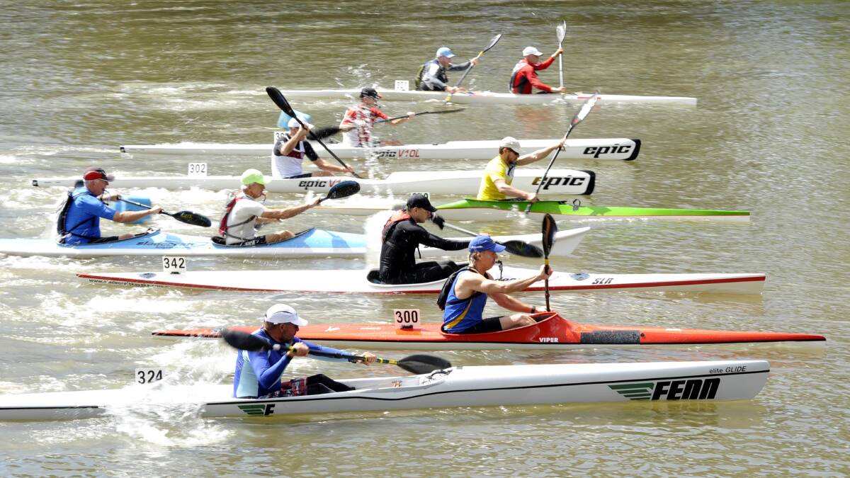 OFF AND RACING: Competitors get underway in the division three event of the Paddle NSW 2014 Marathon series at Wagga Beach on Saturday. Picture: Les Smith