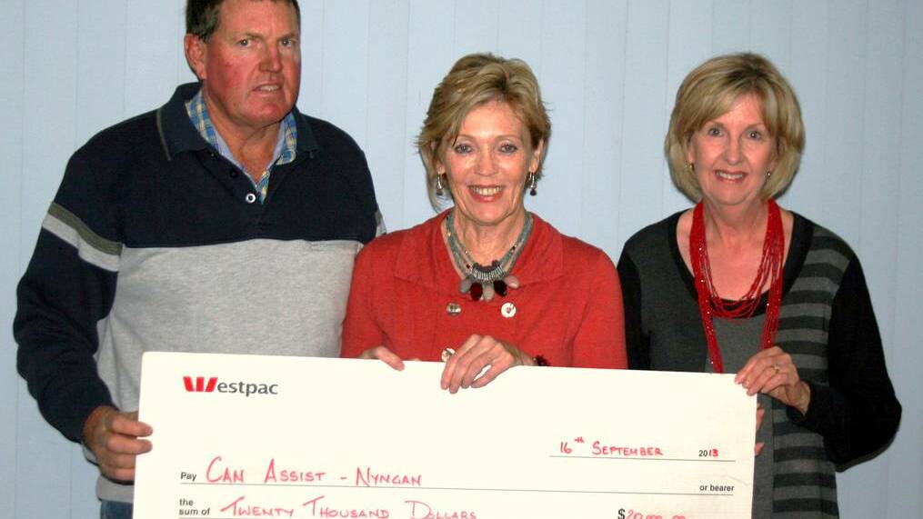 NYNGAN: Terry Tremain presenting Lyn Webster and Merrill Peterson committee members of Can Assist with a cheque for $20,000 from last year’s Nyngan Ag Expo
