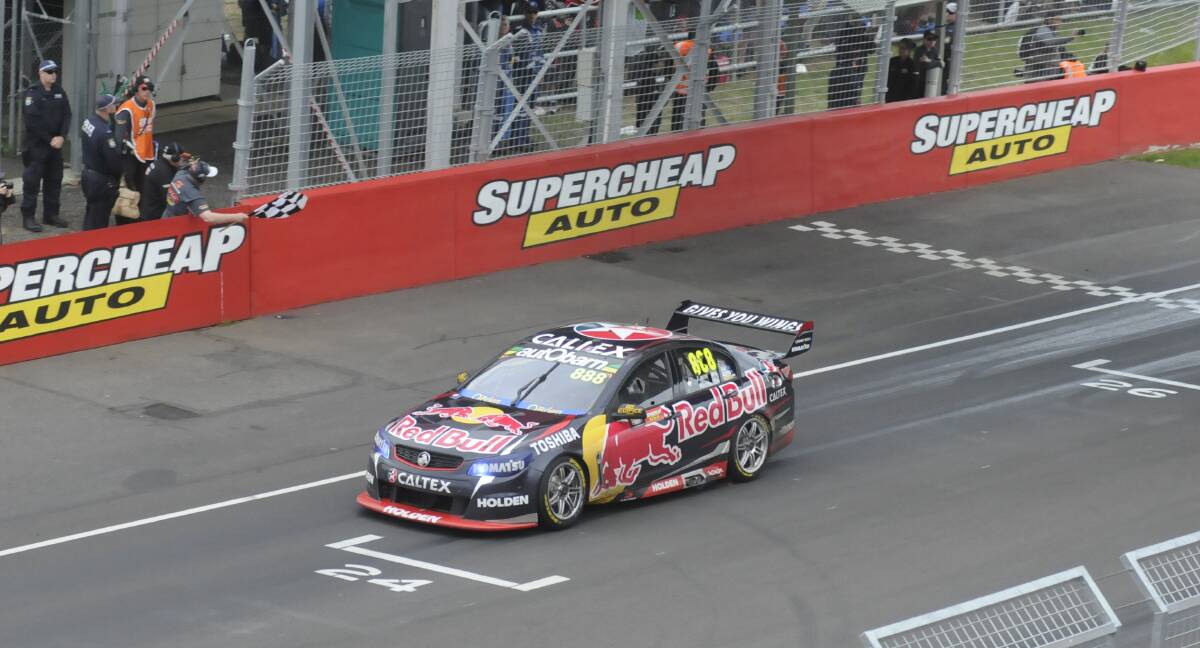 Craig Lowndes crossing the line for his sixth Bathurst 1000 win today. Photo: CHRIS SEABROOK 101115cfinish1