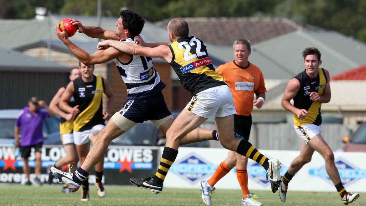 Allansford's Justin Nowell marks in front of Merrivale's Matthew Gleeson at Allansford Recreation Reserve. Picture:LEANNE PICKETT/The Standard