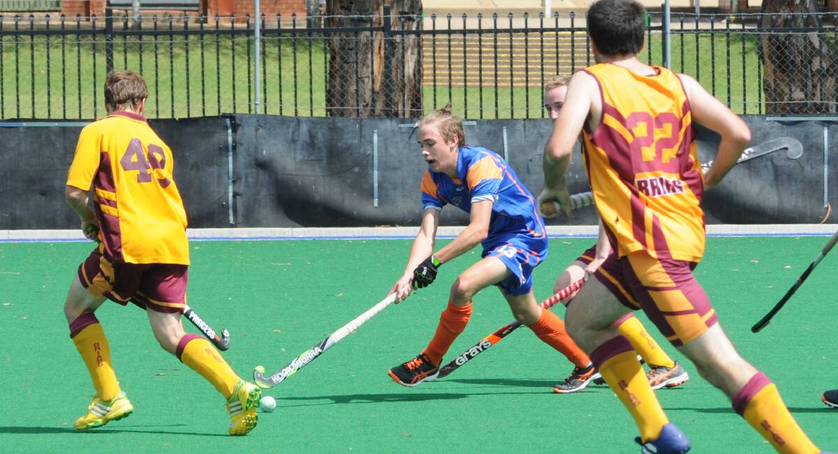 WORKING OUT THE KINKS: Wanderers star midfielder Hayden Dillon works the ball forward in his side's trial loss to Burwood. 
Photo: MARK LOGAN 0301mlhockey