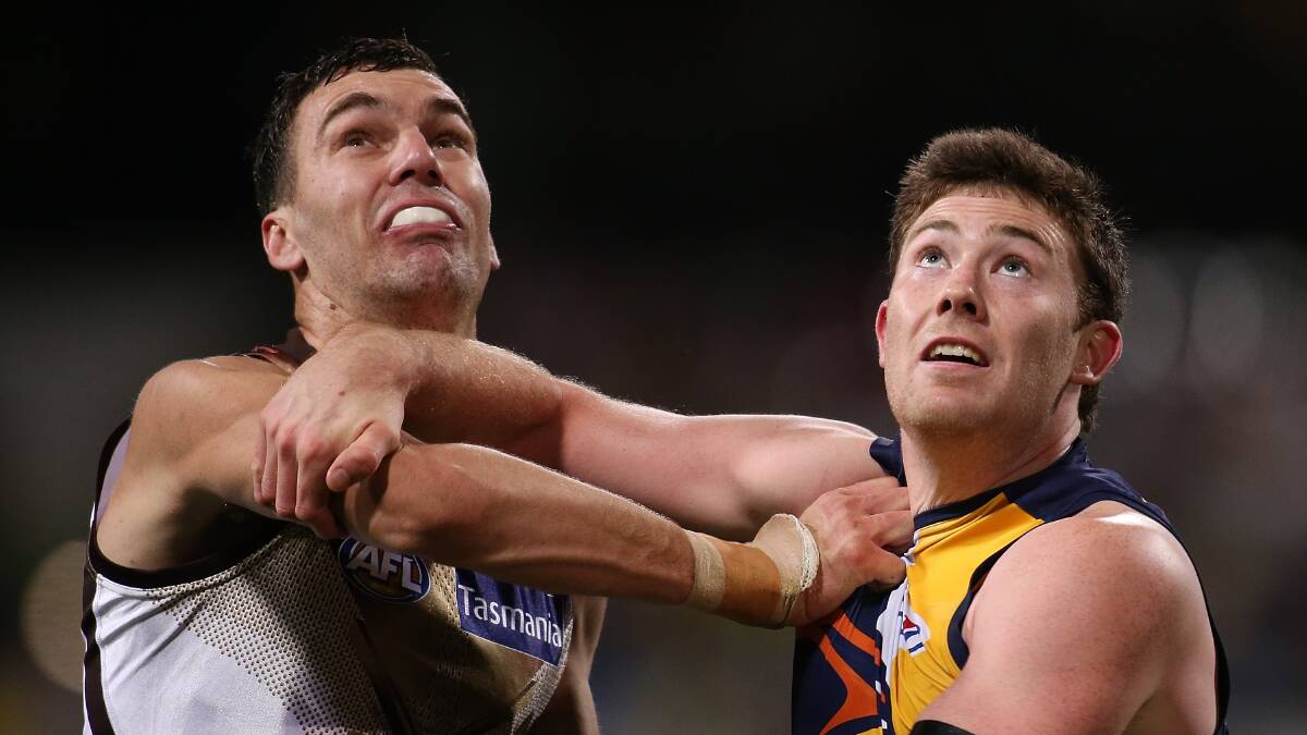 Jonathon Ceglar of the Hawks and Jeremy McGovern of the Eagles contest the ruck during the round 19 AFL match between the West Coast Eagles and the Hawthorn Hawks at Domain Stadium on August 8, 2015 in Perth, Australia. Photo: Paul Kane/Getty Images