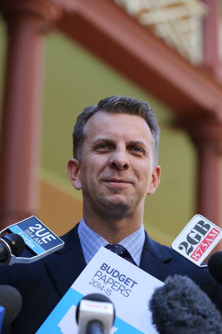 SURPLUS: NSW Treasurer Andrew Constance pictured with the budget papers arriving at NSW Parliament House. Photo: Peter Rae Monday