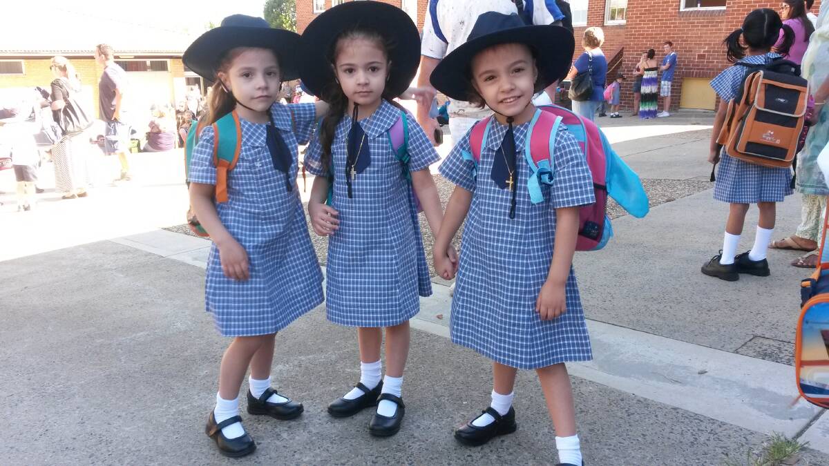 The Zanakis family triplets, Zina, Eva and Georgia, started kindergarten at Bathurst Public School on Thursday. 