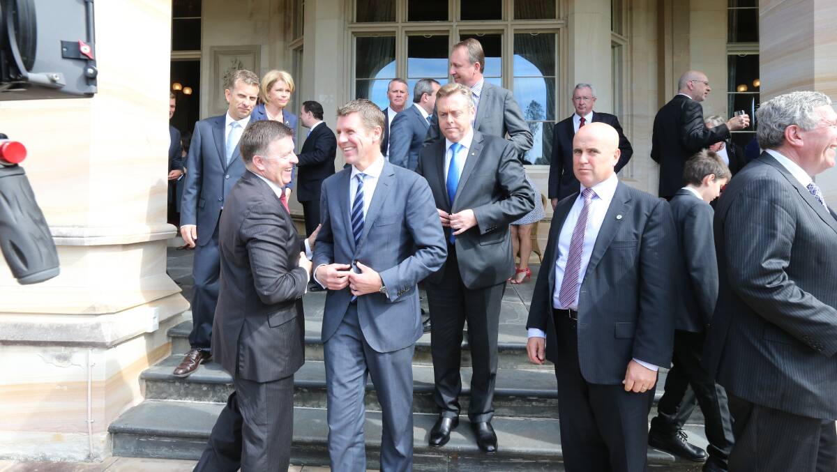 READY TO WORK: NSW Premier Mike Baird, with his new newly appointed Cabinet Ministers, being sworn in at NSW Government House, Sydney. Photos: Peter Rae.