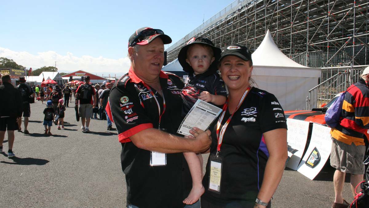 "So the little one is going to grow up to be a race fan too?" "Well his name is Brock so he's got no choice." Keith Kinnear with son Brock and wife Kath.