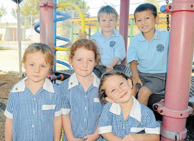 WATTLE FLAT PUBLIC SCHOOL: Front row, Holly McAllister, Alex Clark and
Laci Petford. Back row, Cameron Timms with Phoenix Nguyen. 021014cwattle1