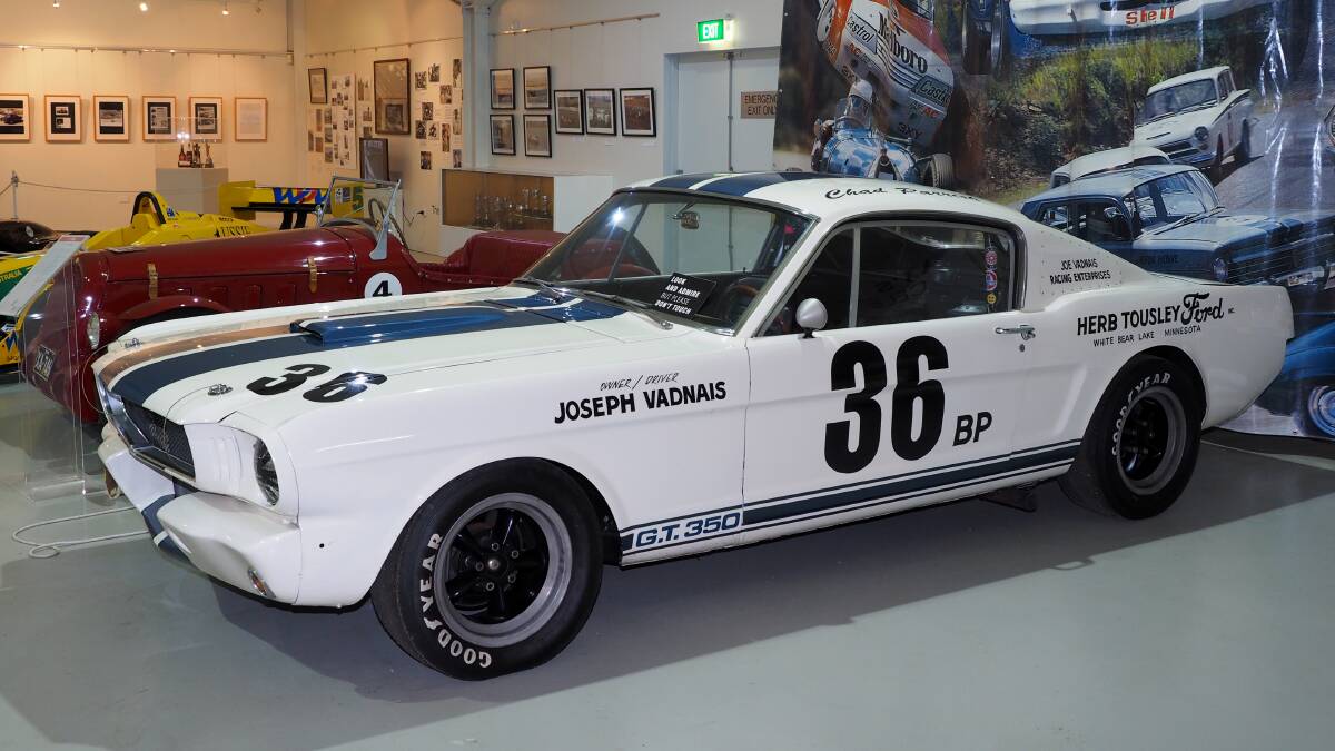 MUSCLE CAR: The 1965 GT 350 Shelby Cobra Mustang – pictured at the National Motor Racing Museum – was one of the early production-based muscle cars to come out of America – and a forerunner of Australia’s home-grown production modified
vehicles that were raced with great success at Mount Panorama. Photo: ZENIO LAPKA 032714zsnap