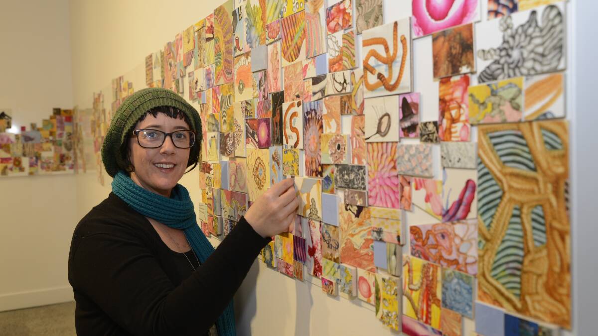 TRIBUTE: Karen Golland installing This is For You at Bathurst Regional Art Gallery ready for tonight’s opening. Photo: PHILL MURRAY 	051216part