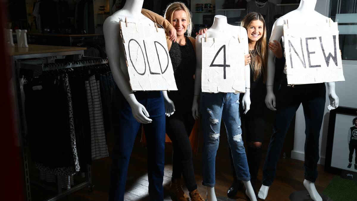 JEANS FOR A CAUSE: Bobbies Clothing employees Hayley Tilley and Emily Wood are ready to accept donations of jeans during the store’s Old 4 New promotion this month. Photo: PHILL BLATCH 	071615pbbobbies