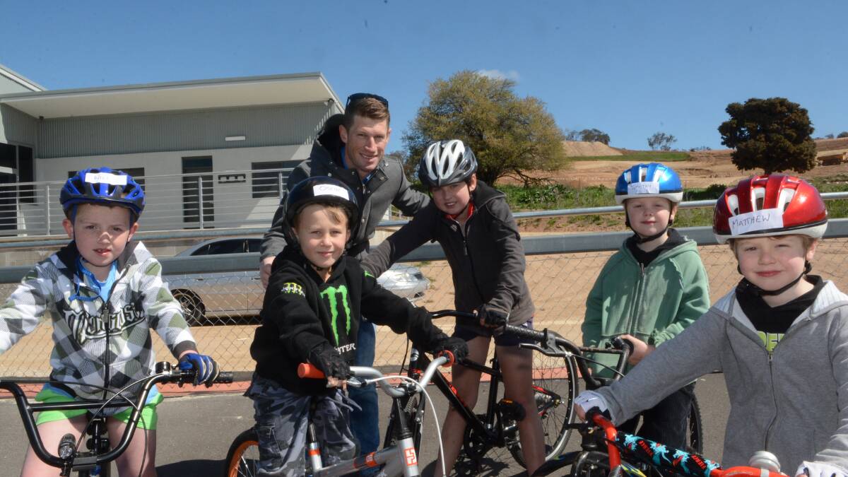 STAR ATTRACTION: Bathurst cycling star Mark Renshaw was king of the kids yesterday as the Bathurst Bike Park velodrome had its first test run. He is pictured with Will Riddings, Oscar Liston, Julian Grace, Tim Capper and Matthew Capper. Photo: PHILL MURRAY 	092415pmark
