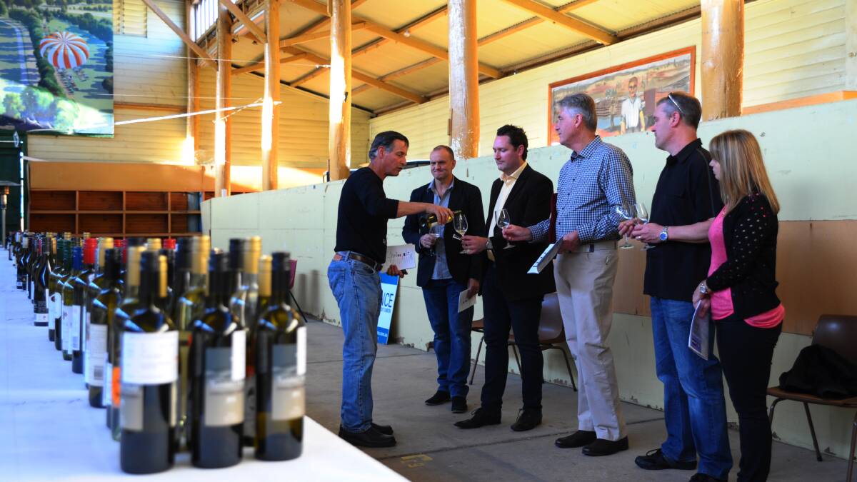 TASTE TEST: Mark Renzaglia from the Bathurst Region Vignerons Association conducts a wine appreciation session during Friday night’s National Cool Climate Wine Show public tasting at Bathurst Showground. Photo: ZENIO LAPKA 	101714zwine2