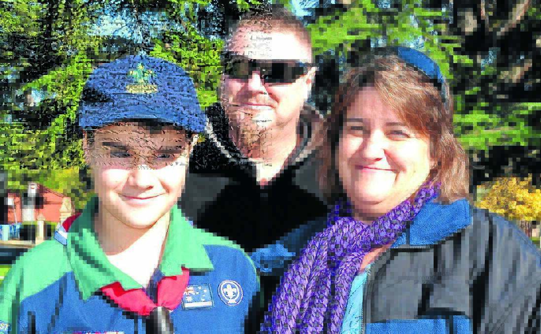 SHARING ANZAC SPIRIT: Craig and Meegan Meekin brought their son Angus (12) to the Anzac Day services on Saturday. Photo: RACHEL FERRETT	 042515rffamily