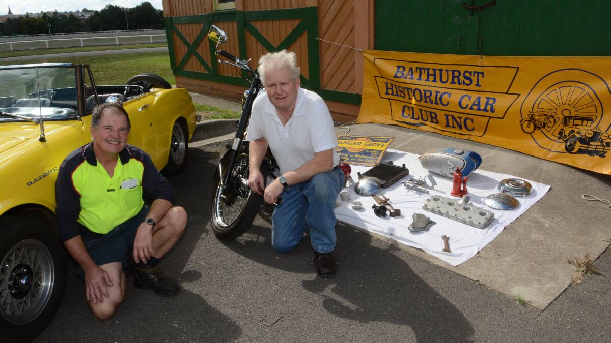 BAGGING A BARGAIN: Bathurst Historic Car Club members Norm Rutherford, with his Datsun “Fair Lady” sports car, and John Hodges, with a BSA 500cc motorcycle, are gearing up for the 29th annual swap meet on Sunday. Photo: PHILL MURRAY 	012215pswap