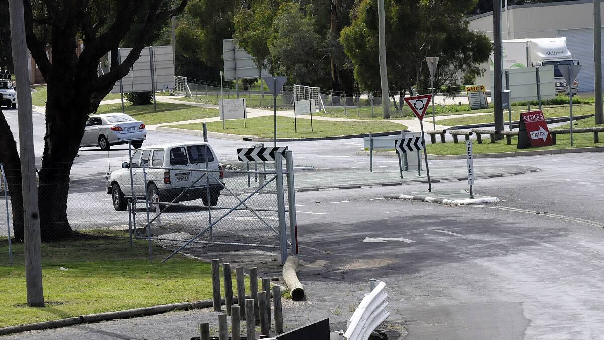 MUST DO BETTER: This roundabout at the entrance to the Mount Panorama motor racing circuit is set to be replaced by a bigger and better version to allow improved access to the precinct. 	041514pround