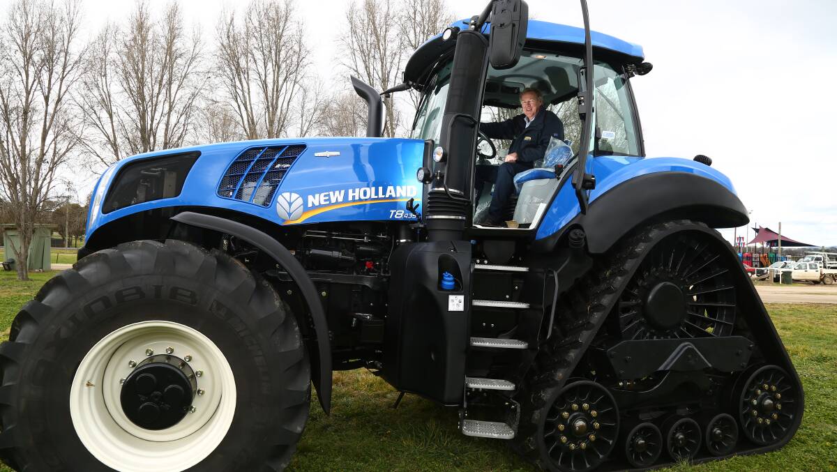 BIG OPPORTUNITY: On-Trac Ag Bathurst dealer and principal Peter Russell, sitting in a T8 SmartTrax TM, had a great time showing off some impressive tractors to customers at yesterday’s On-Trac Ag ‘Come and Drive It’ day. Photo: PHIL BLATCH	 071515pbnew1