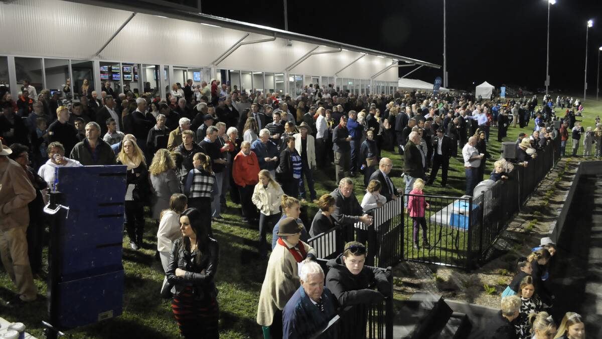 PIECE OF THE ACTION: Around 2000 people attended the Gold Crown finals at the new Bathurst Paceway. Organisers say the event will become bigger in years to come as the Paceway’s reputation grows. Photo: CHRIS SEABROOK 	032815cgoldc7