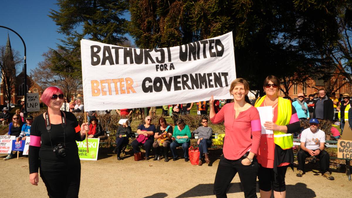 WHAT DO WE WANT?: Alyson Laver, Sophie Meredith and Melanie Hood were the women behind the inaugural March Australia protest in Bathurst yesterday. Photo: ZENIO LAPKA 	083114zprotest