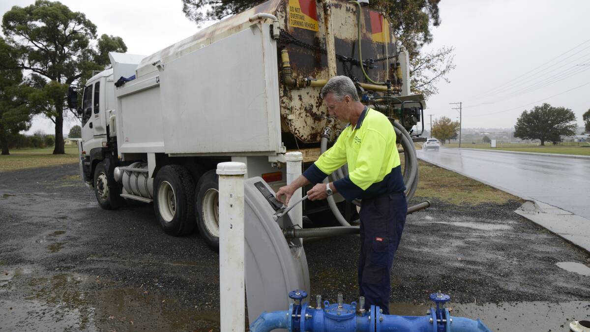 ON THE JOB: Water carter Brent Gowland has been busy transporting water to people in Bathurst with empty tanks. Photo: PHILL MURRAY 	042216pbrent