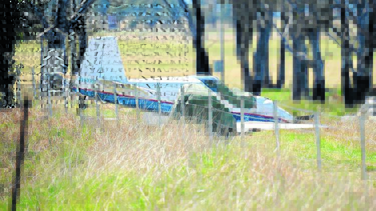 TRAGEDY: Two people were killed yesterday when the light plane they were flying crashed near Mudgee Airport. Photo: COL BOYD 	091414mudgeeplane1