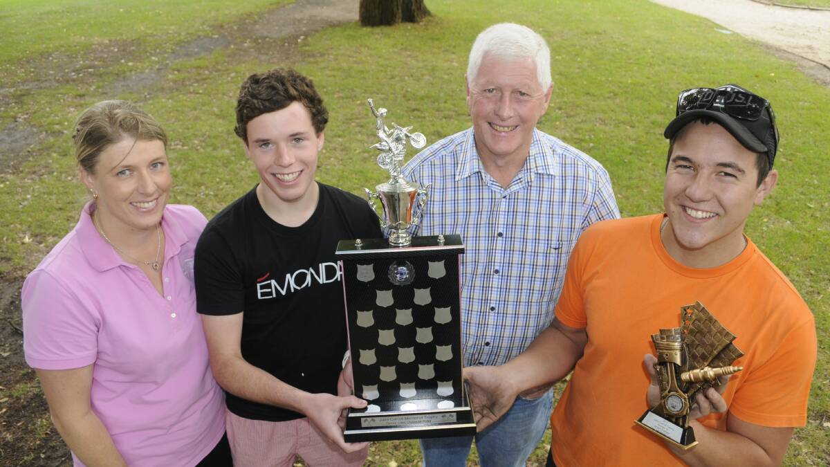HONOUR: Susan Hurt, Joshua Carroll, Bruce Morgan and Jaiden Graham with the Jake Carroll Memorial trophy for the Senior Lites  Clubman Rider. Jaiden was the inaugural winner of the award. Photo: CHRIS SEABROOK 	122315ctrophy1a