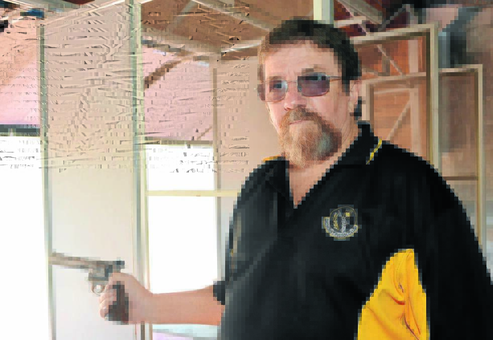 ON TARGET: Bathurst Pistol Club secretary Geoff Arnell says the increase in the number of firearms licences in Bathurst can be attributed to the popularity of sporting and recreational shooting. 
Photo: PHILL MURRAY	 040914ppistol