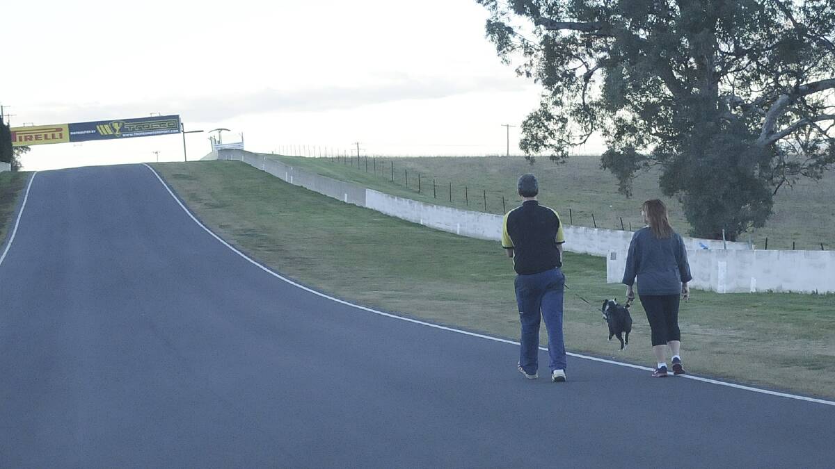KEEP RIGHT: Mount Panorama walkers have been warned they should not walk more than two abreast and should always walk so they are facing the approaching traffic. Photo: CHRIS SEABROOK 	082014cwalkrs4
