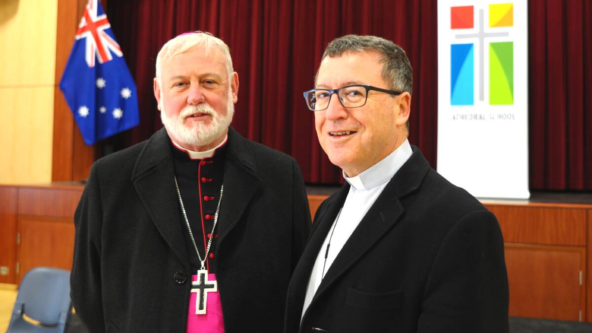 JUST VISITING: Apostolic Nuncio to Australia Archbishop Paul Gallagher with Catholic Bishop Michael McKenna at the Cathedral School Hall yesterday morning. Photo: ZENIO LAPKA 	062914znuncio