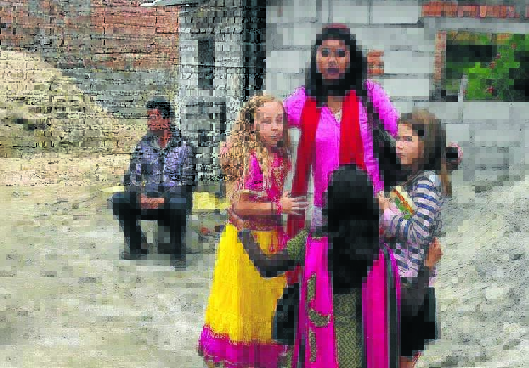 HOLIDAY: An Instagram photo of Indyanna Soames with Nepalese locals before the earthquake struck.