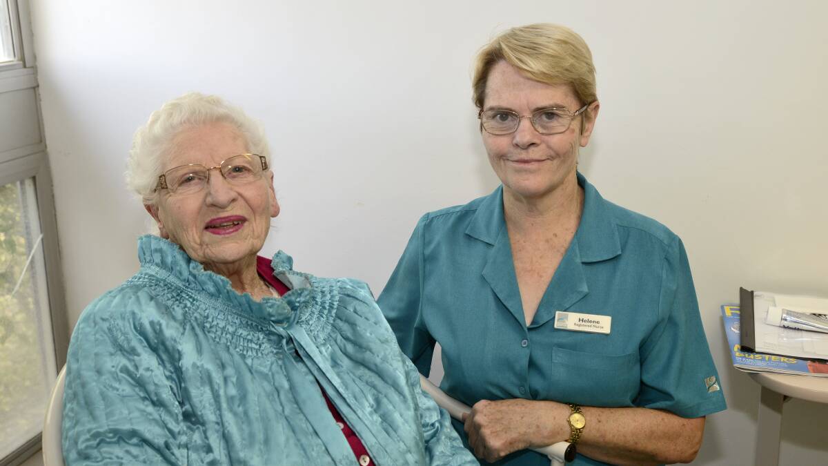 RETIRING AFTER 50 YEARS: Helene Jacobs with June Darke, a patient at Bathurst Private Hospital. 	052016phelene