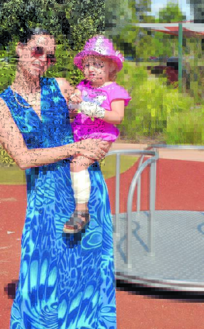 BANDAGED BUB: Renee Simpson, pictured with her daughter Briannah Honeysett, is angry no action has been taken to prevent children being burnt on a roundabout at the adventure playground. Photo: JACINTA CARROLL	 021215jcplay2