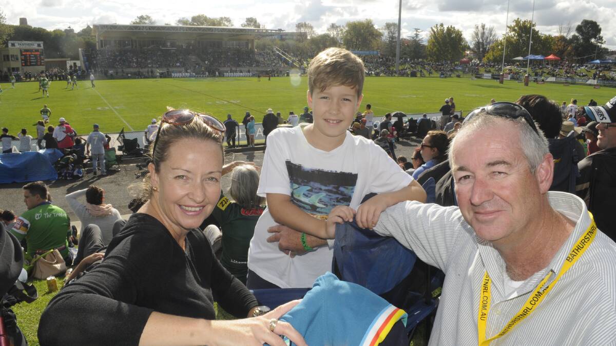 THUMBS UP: Penrith fans Alana, Connor and Cameron Brown had a prime spot on the hill to watch their team claim victory over Canberra. Photo: CHRIS SEABROOK 	043016cnrl1a
